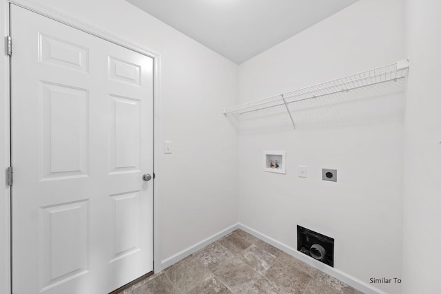 washroom featuring electric dryer hookup, washer hookup, and baseboards