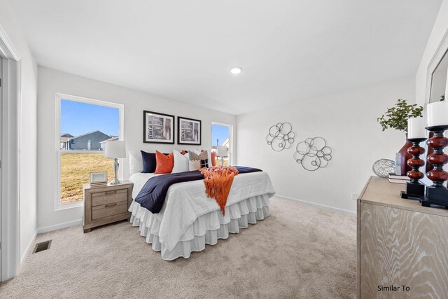 carpeted bedroom with baseboards