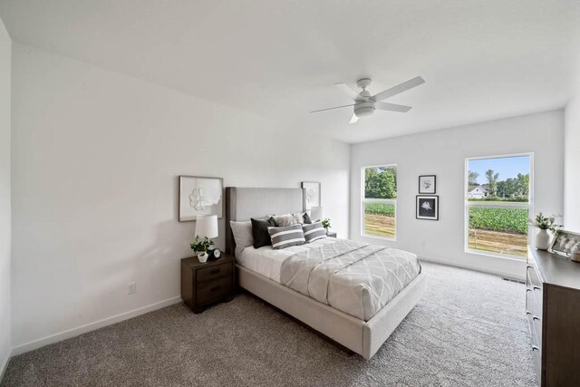 125 NW Rolling Cir, Waukee, IA 50263 - bedroom featuring light carpet and a ceiling fan