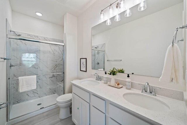 125 NW Rolling Cir, Waukee, IA 50263 - bathroom with a stall shower and double vanity