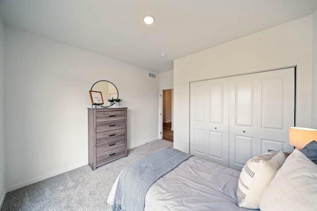 125 NW Rolling Cir, Waukee, IA 50263 - bedroom featuring light colored carpet and a closet