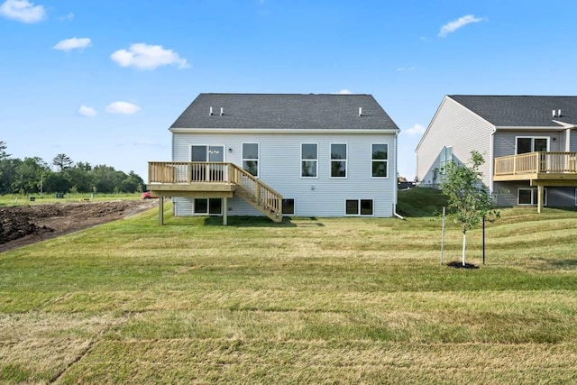 125 NW Rolling Cir, Waukee, IA 50263 - back of property featuring a deck, a lawn, and stairway