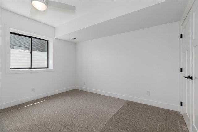1296 Bee Tree Ln, Ellston, IA 50074 - unfurnished room with carpet floors, baseboards, and ceiling fan