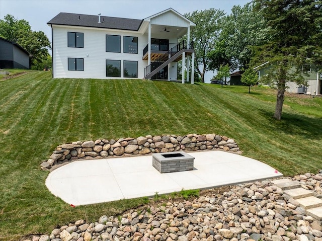 1296 Bee Tree Ln, Ellston, IA 50074 - rear view of house with ceiling fan, stairs, a lawn, and a patio