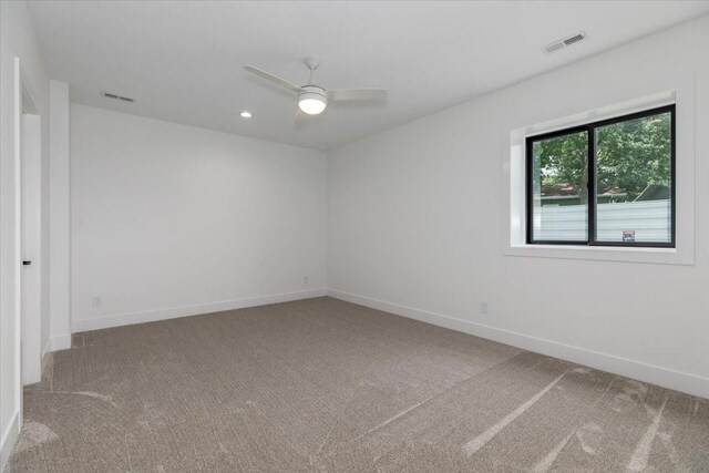 1296 Bee Tree Ln, Ellston, IA 50074 - empty room featuring carpet floors, a ceiling fan, baseboards, and recessed lighting