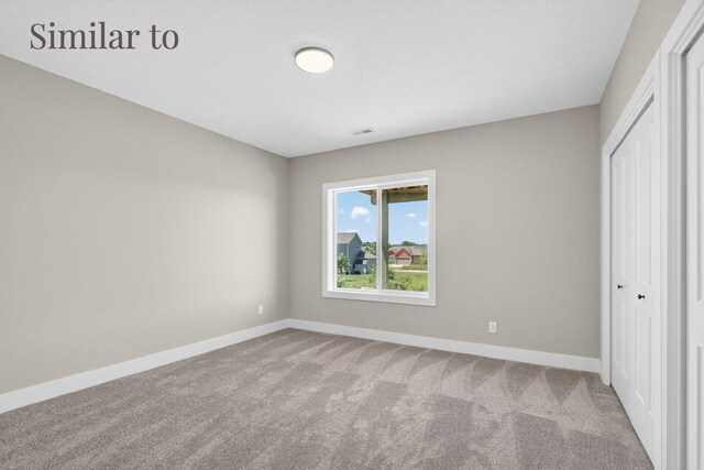 2926 Lake Hill Dr, Des Moines, IA 50320 - unfurnished bedroom featuring carpet and a closet