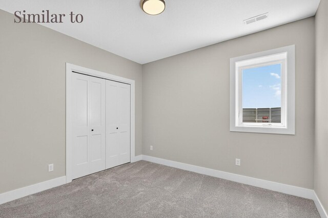 2926 Lake Hill Dr, Des Moines, IA 50320 - unfurnished bedroom with carpet flooring and a closet