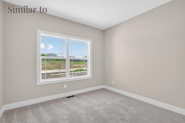 2926 Lake Hill Dr, Des Moines, IA 50320 - spare room featuring carpet flooring and baseboards