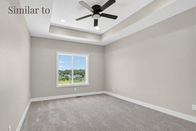 2926 Lake Hill Dr, Des Moines, IA 50320 - carpeted empty room featuring a ceiling fan, recessed lighting, and a tray ceiling
