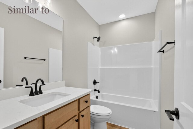 2926 Lake Hill Dr, Des Moines, IA 50320 - bathroom with vanity, washtub / shower combination, and wood finished floors