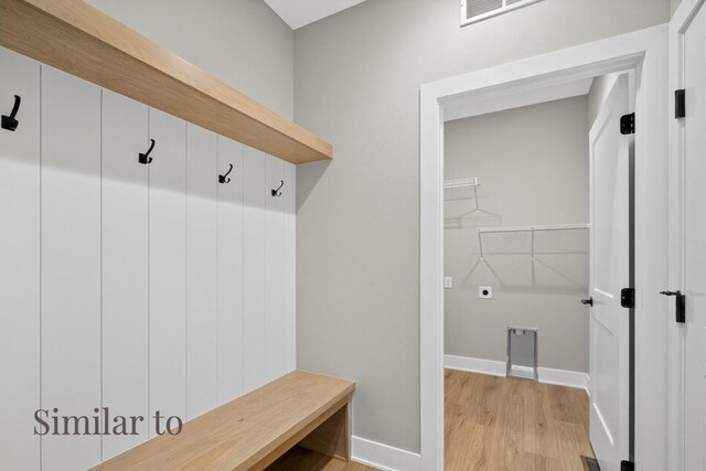 2926 Lake Hill Dr, Des Moines, IA 50320 - mudroom featuring light wood-style floors and baseboards