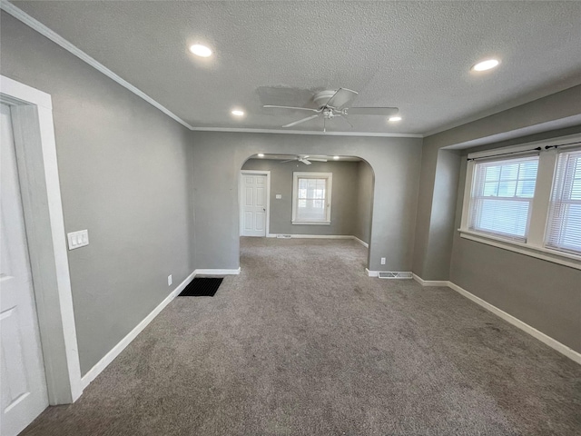 1144 Euclid Ave, Des Moines, IA 50313 - carpeted spare room with baseboards, arched walkways, ceiling fan, and ornamental molding
