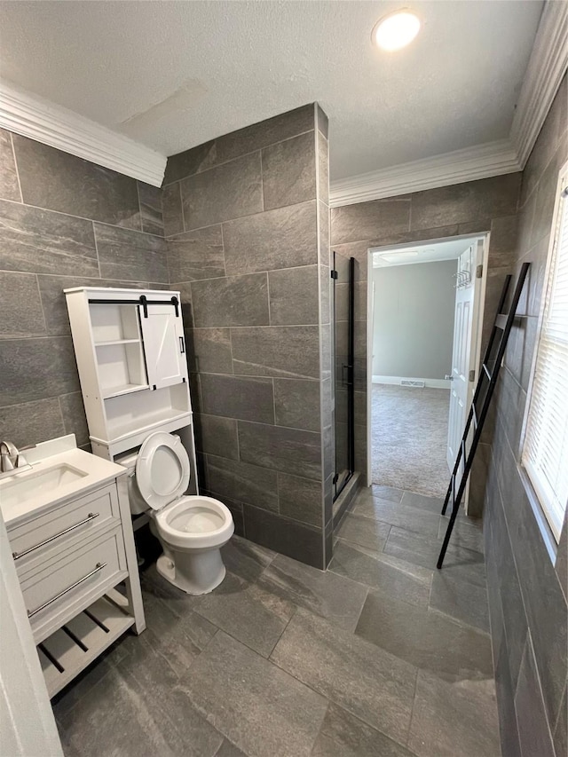 1144 Euclid Ave, Des Moines, IA 50313 - full bathroom featuring a stall shower, vanity, ornamental molding, and tile walls