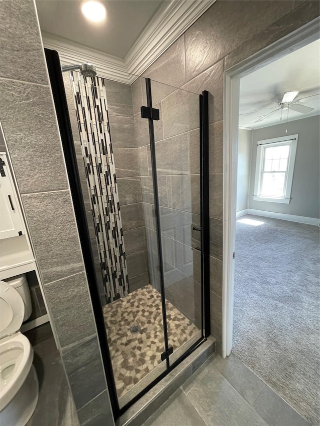 1144 Euclid Ave, Des Moines, IA 50313 - full bath featuring a shower stall, baseboards, ornamental molding, toilet, and a ceiling fan