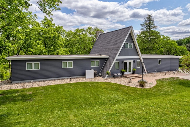 3265 Dartmoor Rd, Ames, IA 50014 - back of property featuring french doors, a yard, and a chimney