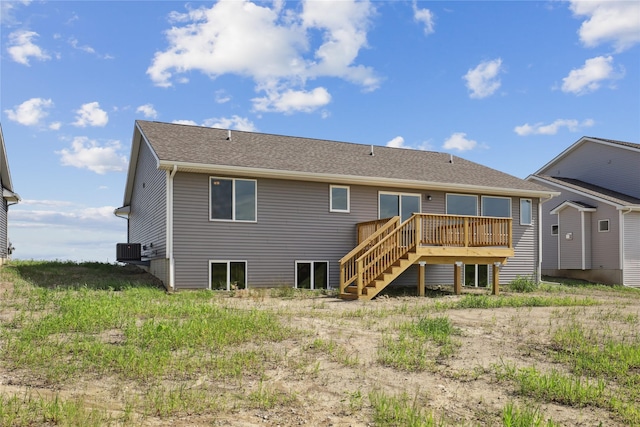 1430 Werthman Dr, Waukee, IA 50263 - back of property with a wooden deck, stairs, and roof with shingles