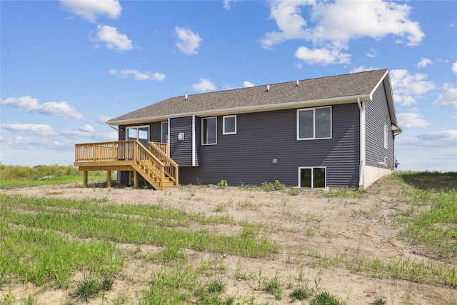 1440 Werthman Dr, Waukee, IA 50263 - back of house with a deck, stairs, and roof with shingles