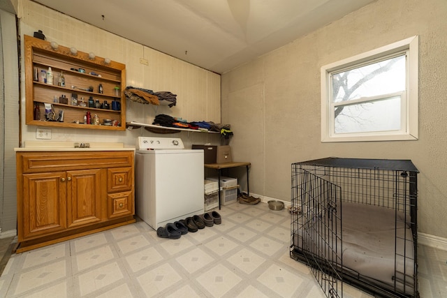 2141 320th St, Fort Dodge, IA 50501 - washroom with cabinet space, washer / dryer, and light floors