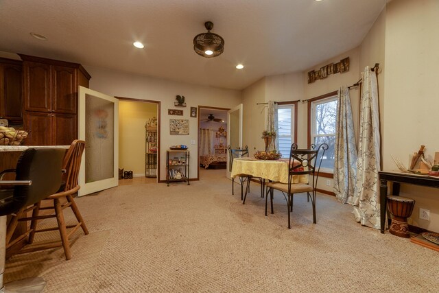 2141 320th St, Fort Dodge, IA 50501 - dining area featuring light colored carpet, baseboards, and recessed lighting