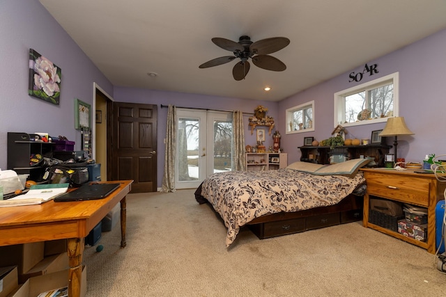 2141 320th St, Fort Dodge, IA 50501 - bedroom featuring access to exterior, a ceiling fan, and light colored carpet