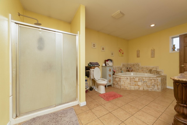 2141 320th St, Fort Dodge, IA 50501 - full bathroom featuring a stall shower, tile patterned floors, toilet, a bath, and visible vents
