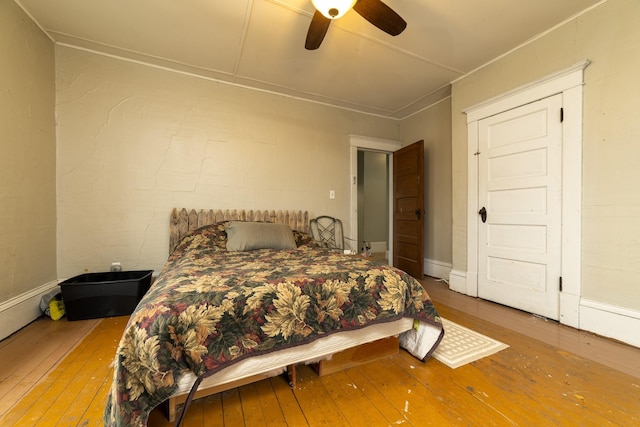2141 320th St, Fort Dodge, IA 50501 - bedroom with hardwood / wood-style flooring and a ceiling fan