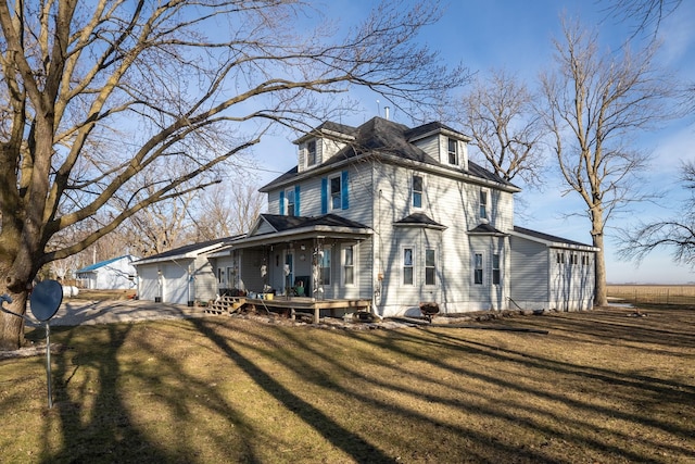 2141 320th St, Fort Dodge, IA 50501 - back of house featuring a yard and an attached garage