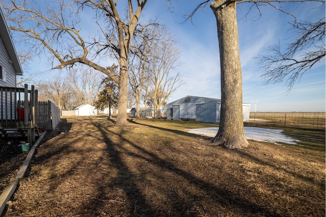 2141 320th St, Fort Dodge, IA 50501 - view of yard featuring an outbuilding and fence