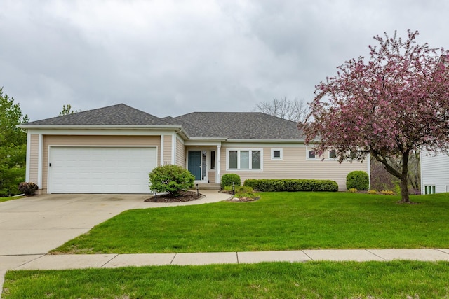 9840 Brookview Dr, Urbandale, IA 50322 - ranch-style home featuring a front lawn, a shingled roof, driveway, and a garage