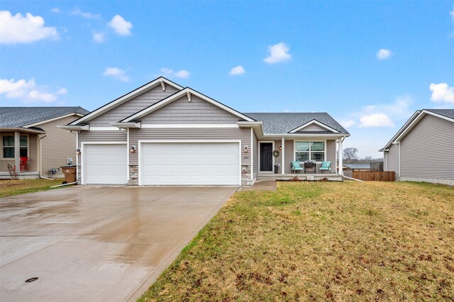 single story home featuring concrete driveway, stone siding, a front yard, a porch, and a garage