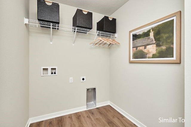 1911 20th Ave SE, Altoona, IA 50009 - laundry room with laundry area, wood finished floors, baseboards, electric dryer hookup, and washer hookup