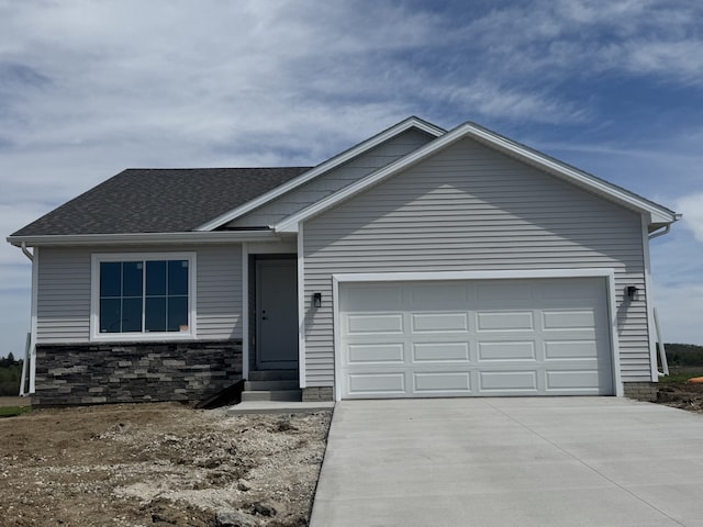 1911 20th Ave SE, Altoona, IA 50009 - ranch-style house with entry steps, an attached garage, concrete driveway, and roof with shingles