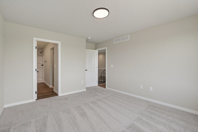 1911 20th Ave SE, Altoona, IA 50009 - unfurnished bedroom with carpet and ensuite bathroom