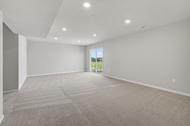 1911 20th Ave SE, Altoona, IA 50009 - spare room featuring carpet floors, recessed lighting, and a textured ceiling