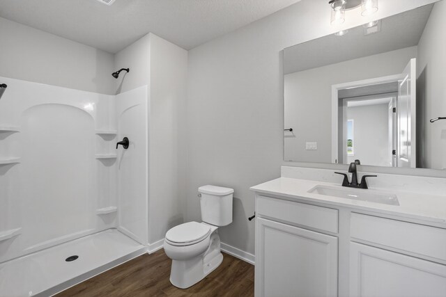 1911 20th Ave SE, Altoona, IA 50009 - full bath featuring a shower, wood finished floors, and vanity