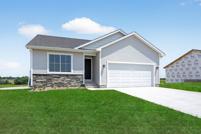 1911 20th Ave SE, Altoona, IA 50009 - view of front of property featuring a front lawn, a garage, concrete driveway, and a shingled roof