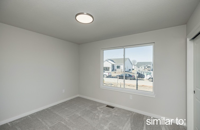 16614 Walnut Meadows Dr, Urbandale, IA 50323 - carpeted empty room featuring baseboards and visible vents