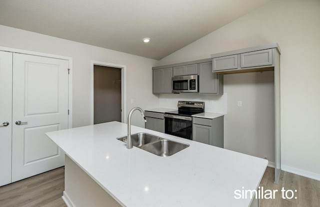 16614 Walnut Meadows Dr, Urbandale, IA 50323 - kitchen featuring a sink, appliances with stainless steel finishes, gray cabinets, and light wood-style floors