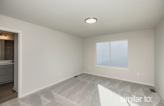 16614 Walnut Meadows Dr, Urbandale, IA 50323 - spare room with carpet floors, baseboards, and visible vents