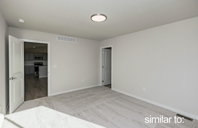 16614 Walnut Meadows Dr, Urbandale, IA 50323 - unfurnished bedroom with visible vents, carpet, and baseboards