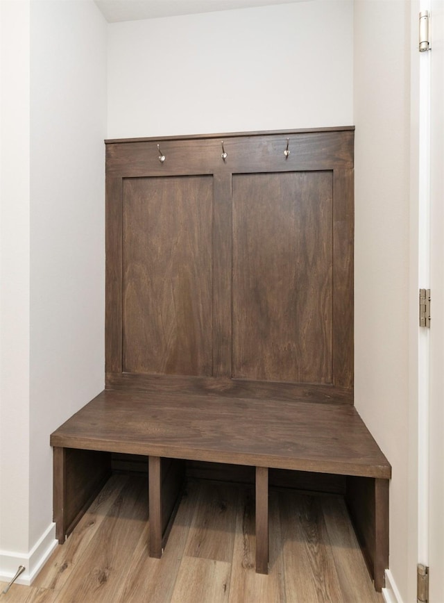 6411 NE 11th Ct, Des Moines, IA 50313 - mudroom featuring baseboards and wood finished floors