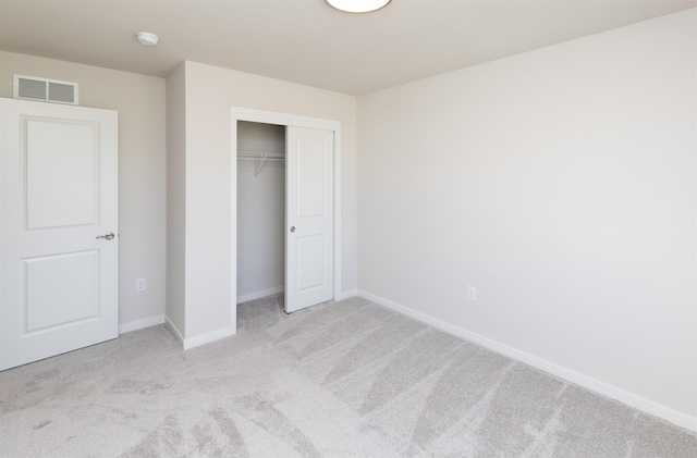 6411 NE 11th Ct, Des Moines, IA 50313 - unfurnished bedroom with carpet floors, baseboards, and a closet