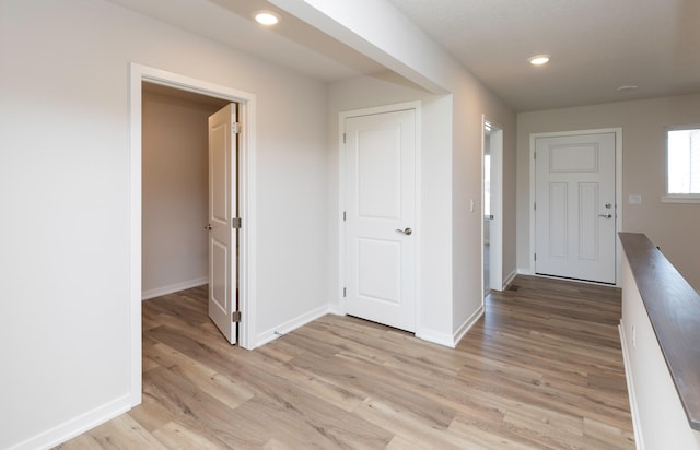 6411 NE 11th Ct, Des Moines, IA 50313 - entryway featuring light wood-type flooring, baseboards, and recessed lighting