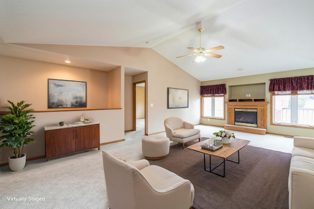 living room with vaulted ceiling, plenty of natural light, a ceiling fan, and light carpet