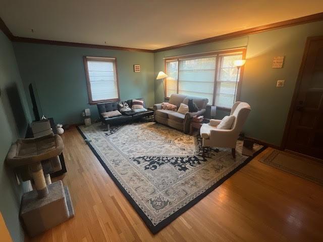 807 Virginia Ave, Des Moines, IA 50315 - living area featuring ornamental molding and wood finished floors