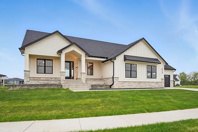 18167 Alderleaf Dr, Clive, IA 50325 - modern inspired farmhouse featuring board and batten siding, a front lawn, stone siding, and a standing seam roof