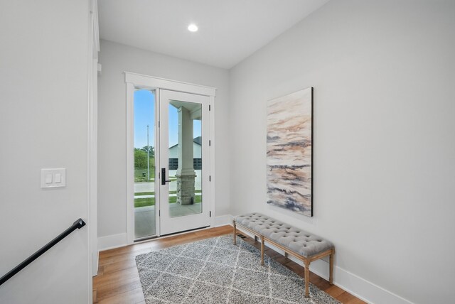 18167 Alderleaf Dr, Clive, IA 50325 - doorway to outside featuring light wood-style floors, baseboards, and recessed lighting