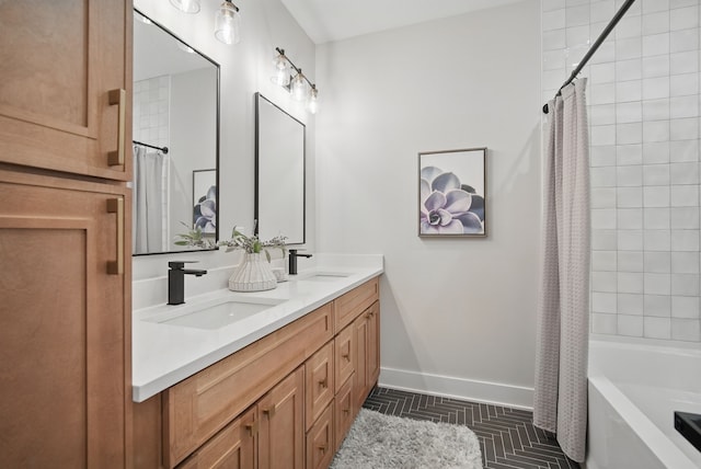 18167 Alderleaf Dr, Clive, IA 50325 - bathroom featuring baseboards, double vanity, and shower / tub combo with curtain