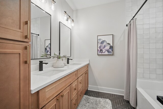 18167 Alderleaf Dr, Clive, IA 50325 - full bath with baseboards, double vanity, and shower / bath combination with curtain
