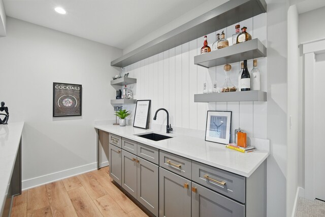 18167 Alderleaf Dr, Clive, IA 50325 - indoor dry bar featuring light wood finished floors, baseboards, and recessed lighting